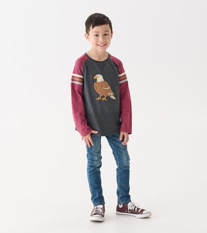 Long sleeve raglan t-shirt with a gray body and maroon sleeves, featuring an eagle graphic on the front.