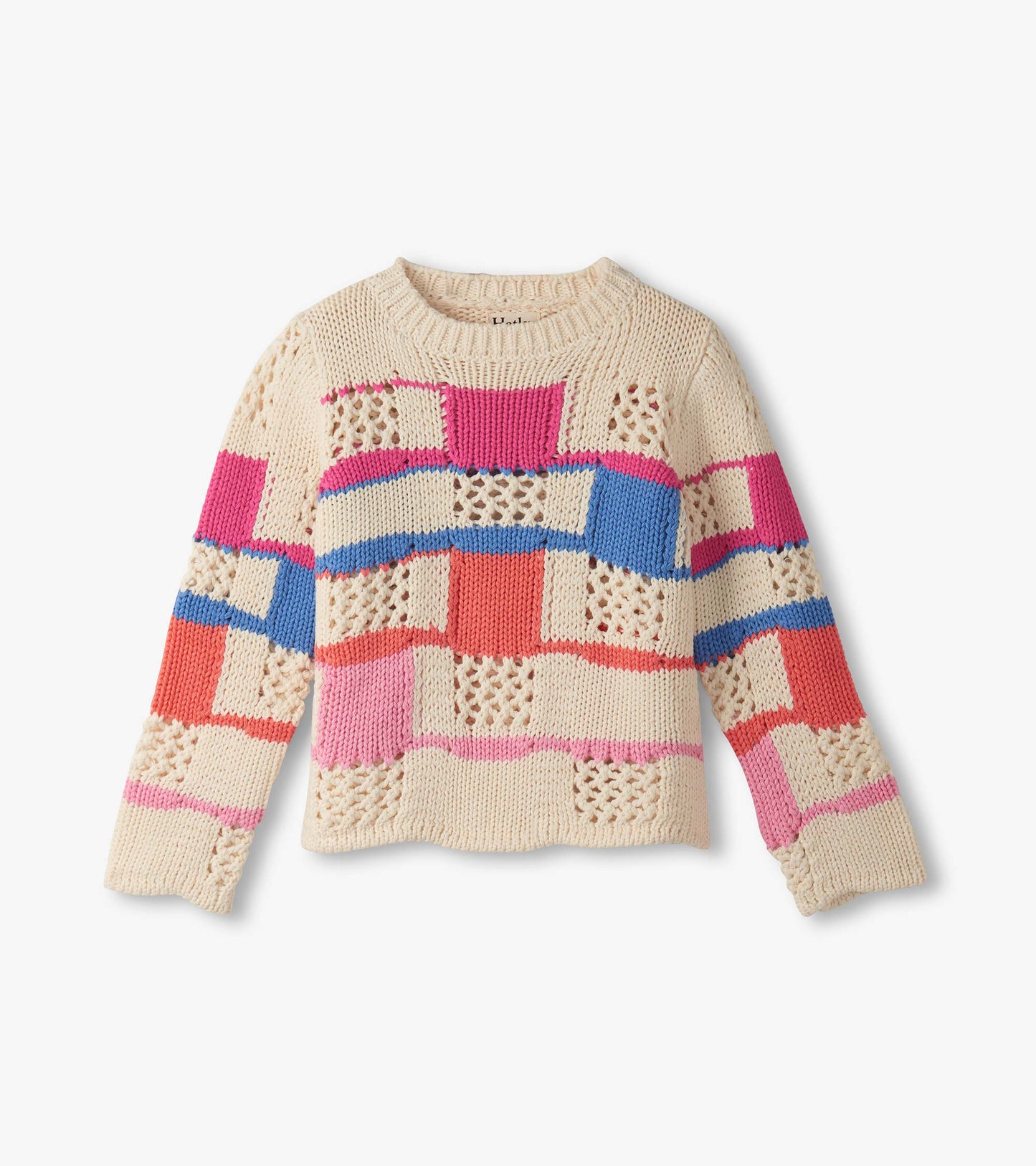 Cream sweater featuring a mix of colorful patchwork patterns in pink, blue, and red with a round neckline and long sleeves.