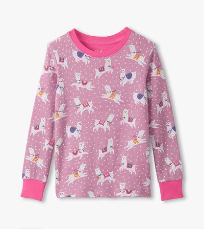 Pink cotton pyjama top featuring playful dancing alpacas and polka dots, with long sleeves and a bright pink neckline.