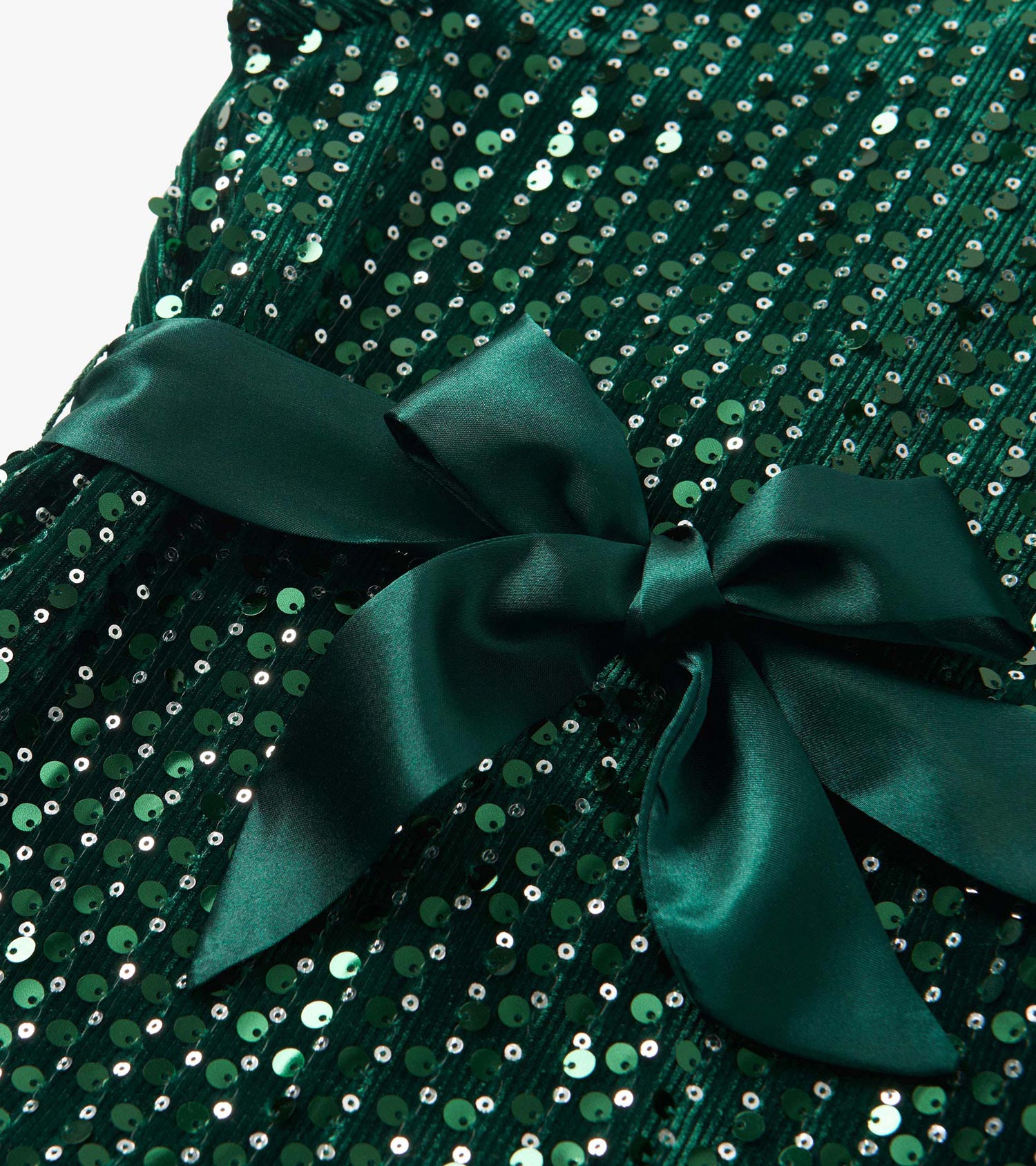 Green velvet dress adorned with sequins and a satin bow detail.