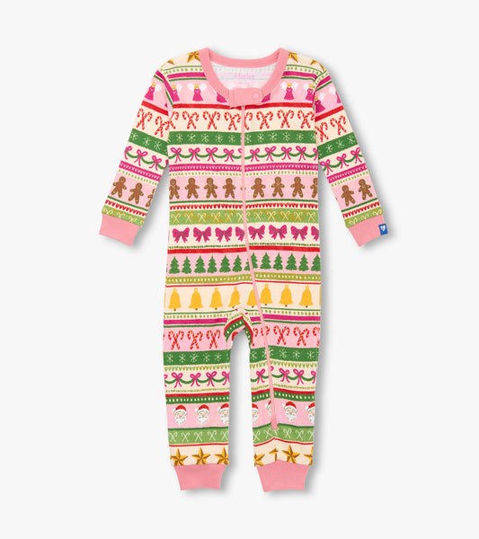 Pink cotton sleeper featuring a fun Fair Isle pattern with gingerbread, bows, and Christmas motifs.