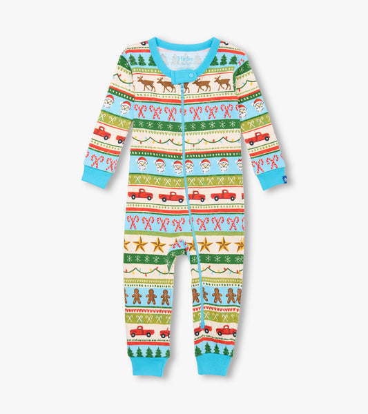Blue cotton sleeper featuring a fun Fair Isle pattern with festive motifs like reindeer, trees, and trucks.