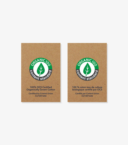 Two organic cotton certification labels on brown cardboard, one in English and one in French.