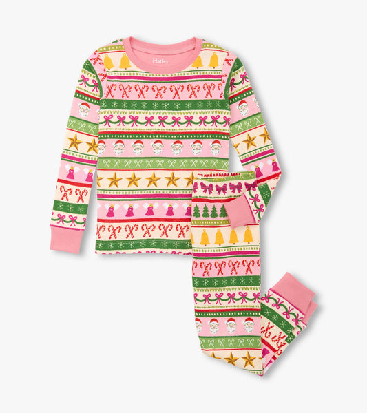 Girls' pink cotton pyjama set featuring a festive Fair Isle pattern with Santa, candy canes, and holiday motifs.