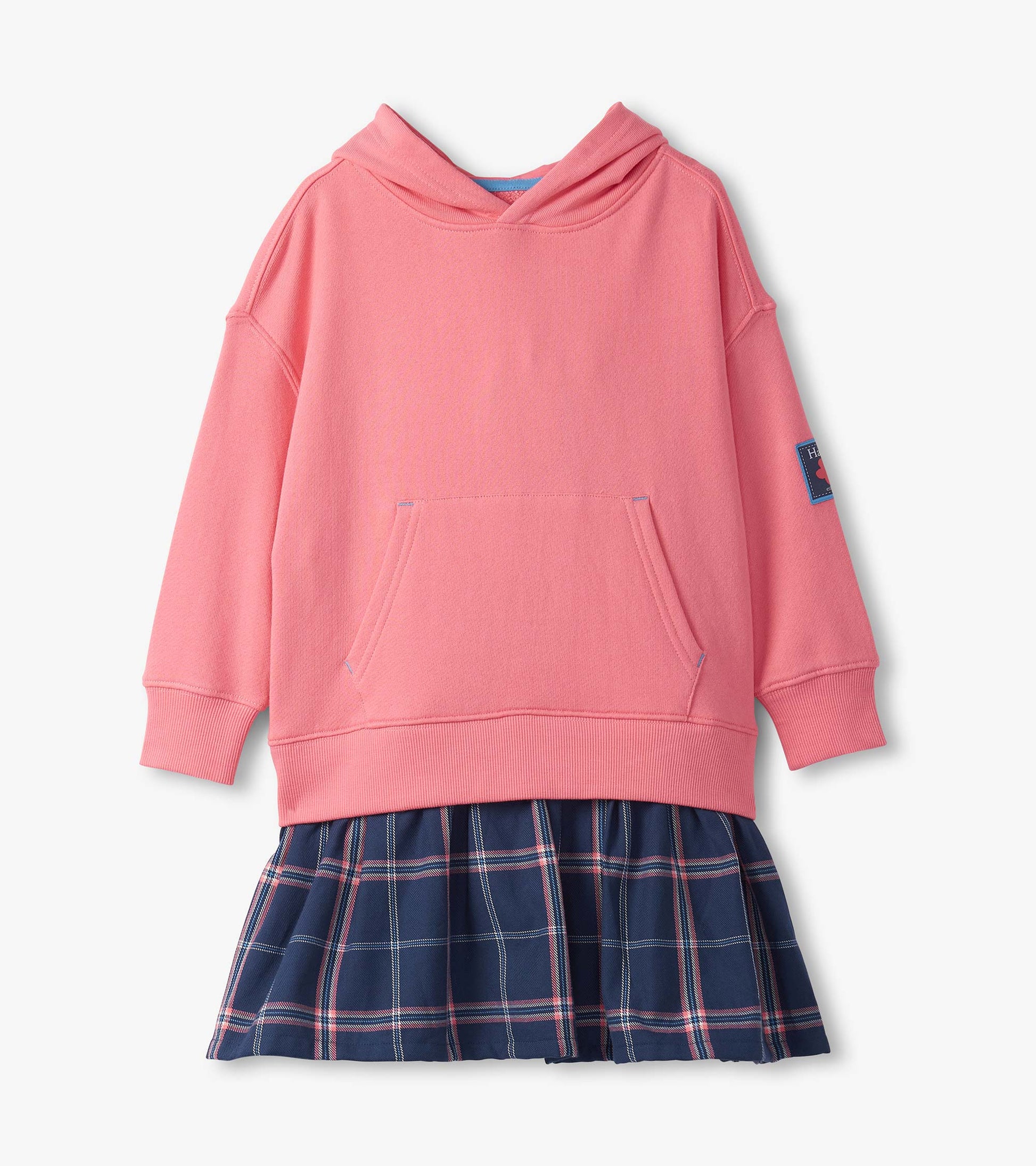 Pink hooded top with a front pocket, paired with a navy plaid skirt featuring pleats.