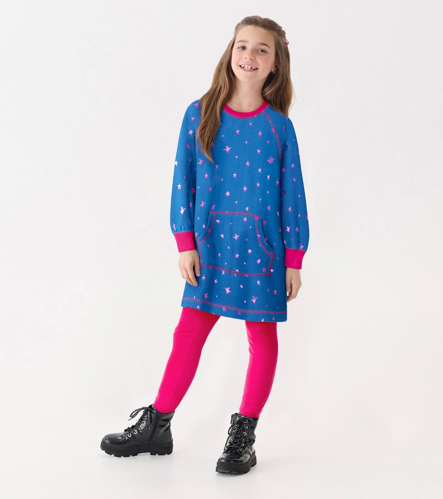 Blue sweater dress with pink foil stars, long sleeves, and a front pocket, paired with pink leggings and black boots.