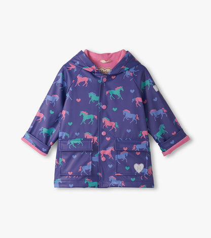 Purple raincoat featuring colorful horse and heart patterns, with a pink hood lining and front pockets.