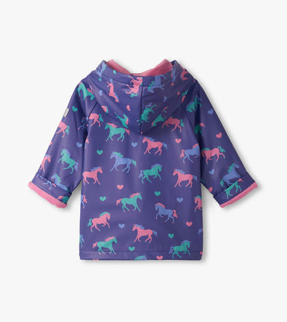 Purple raincoat featuring colorful unicorns and hearts, with a hood and pink trim, suitable for baby and toddler girls.