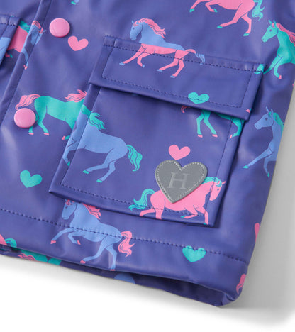 Purple raincoat featuring colorful horse and heart patterns, with pink buttons and a heart-shaped logo patch.