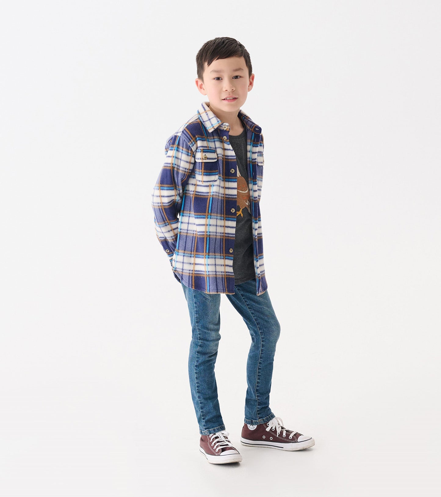 Blue and white plaid fleece button-up shirt on a boy, styled with jeans and sneakers.