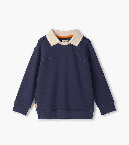 Patriot blue pullover with a cream collar, featuring long sleeves and a small emblem on the chest.