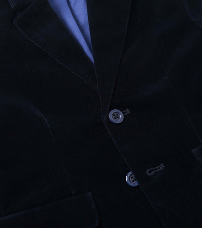Navy velveteen holiday blazer with two buttons and a notched collar, featuring a blue satin lining.