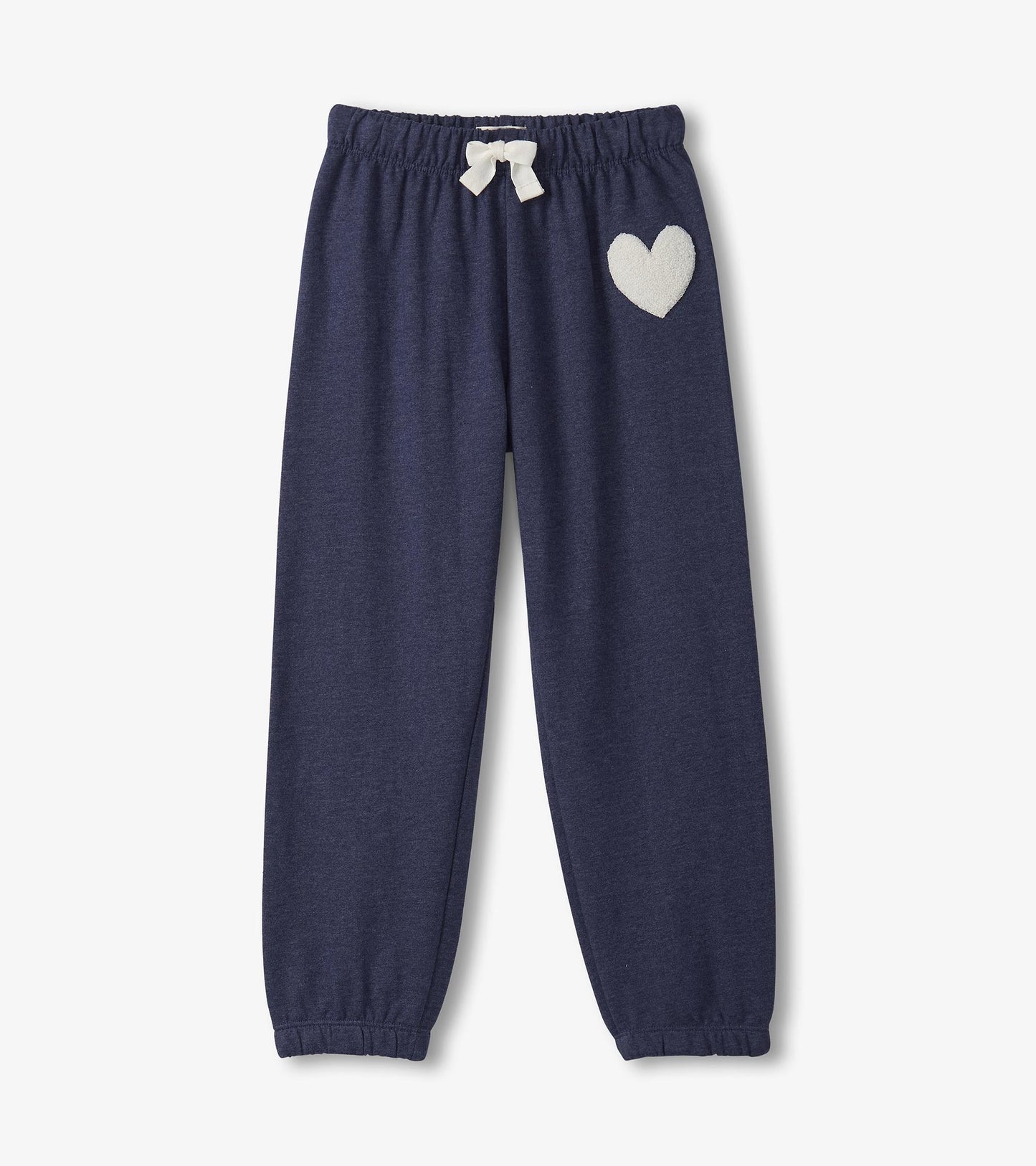 Patriot blue baggy track pants with an elastic waistband and a white heart patch on the side.