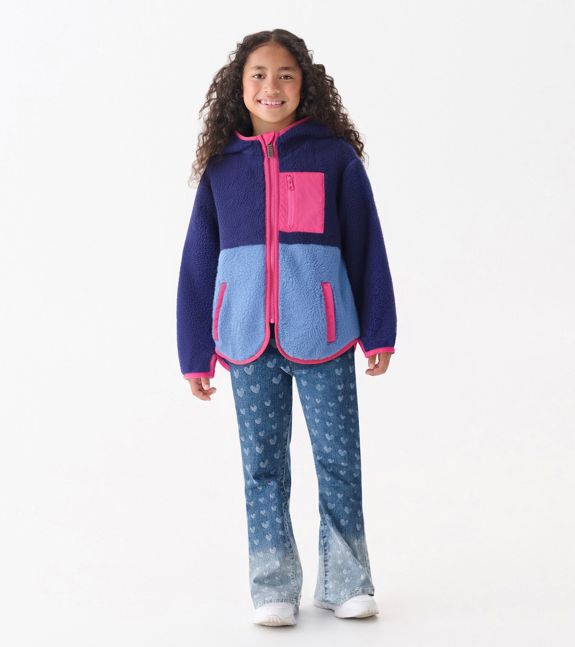 Royal blue and light blue colourblock faux sherpa jacket with pink accents and a hood, featuring a front zipper and pockets.