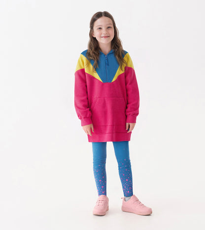 Color block half-zip dress in pink, blue, and yellow, paired with blue leggings featuring pink star patterns.