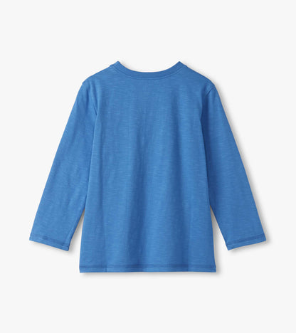 Long sleeve graphic tee in bright blue with a soft texture, featuring a round neckline and relaxed fit.