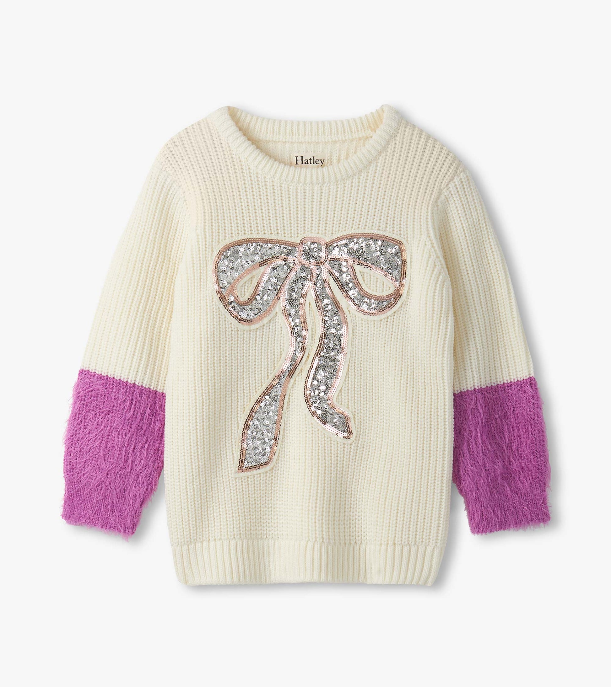 Cream sweater with fluffy purple sleeves and a sequined bow design on the front.