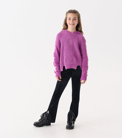 Radiant orchid chenille pullover sweater with star patterns, hood, and a relaxed fit, paired with black flared pants.