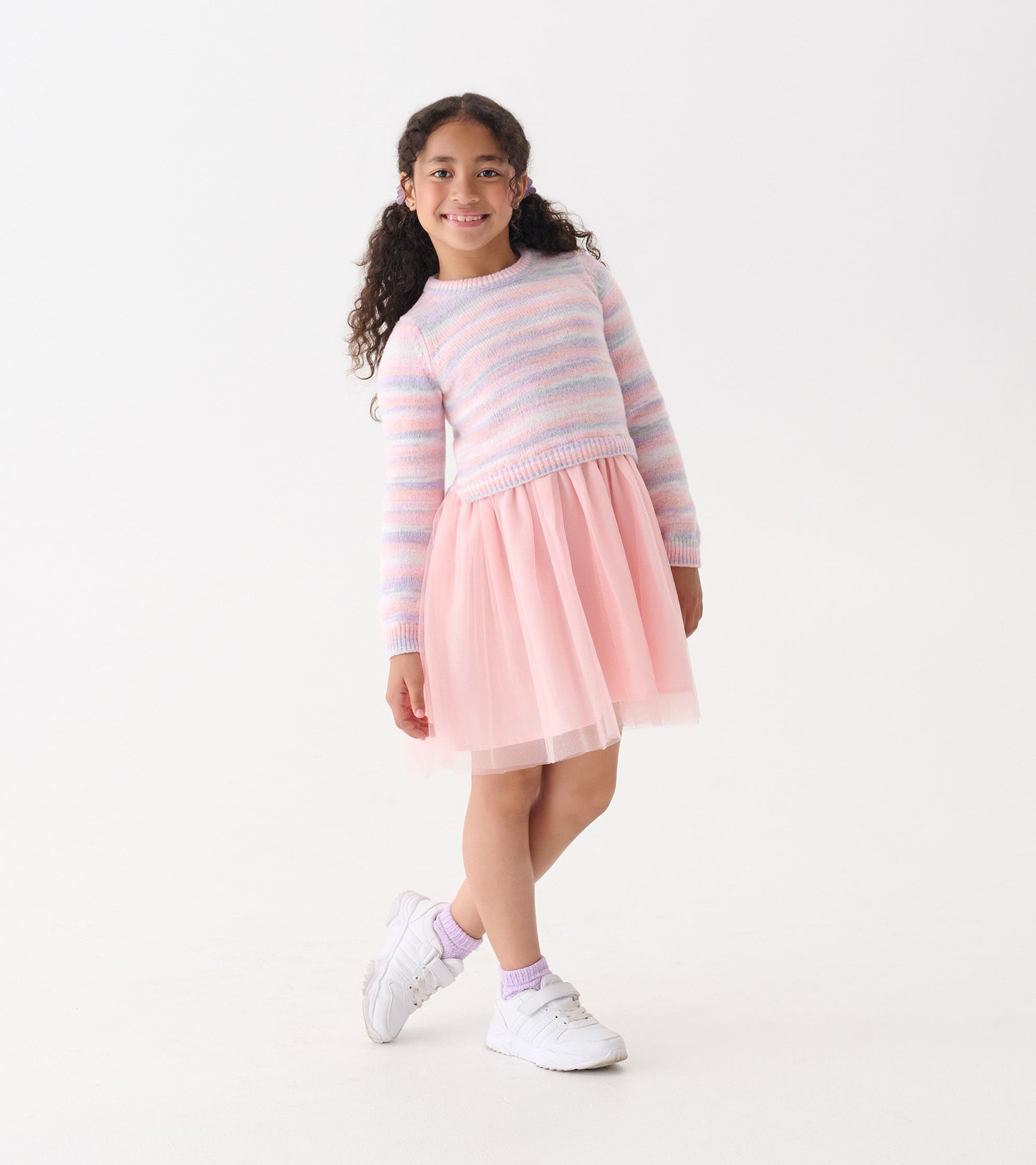 Pastel rainbow striped long-sleeve top with a pink tulle skirt, perfect for casual wear.
