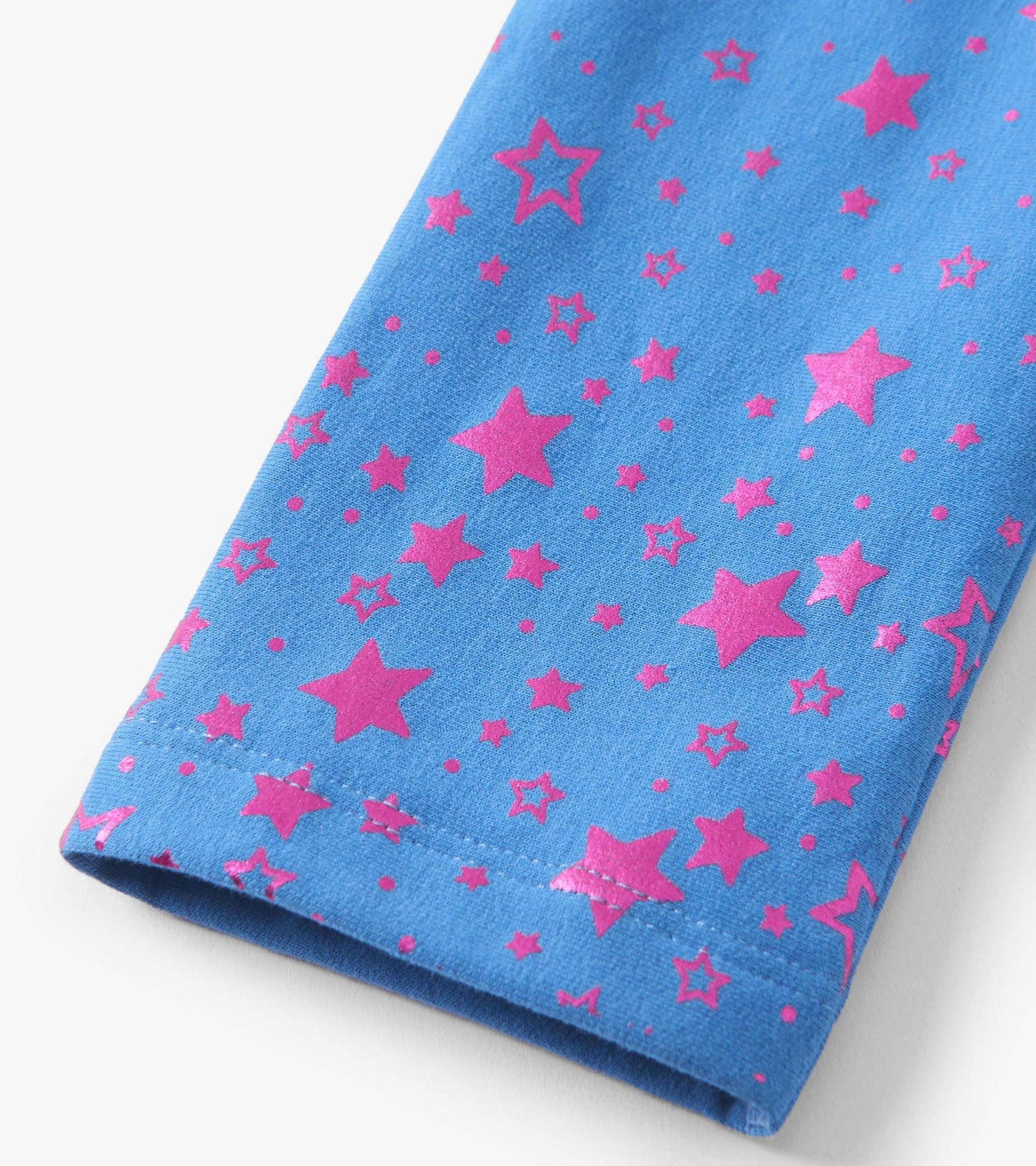 Blue leggings featuring a playful pattern of pink stars, made from soft, cozy material.