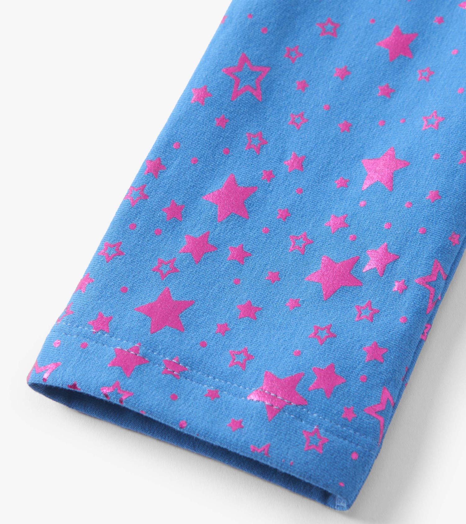 Blue leggings featuring a playful pattern of pink stars, made from soft, cozy material.