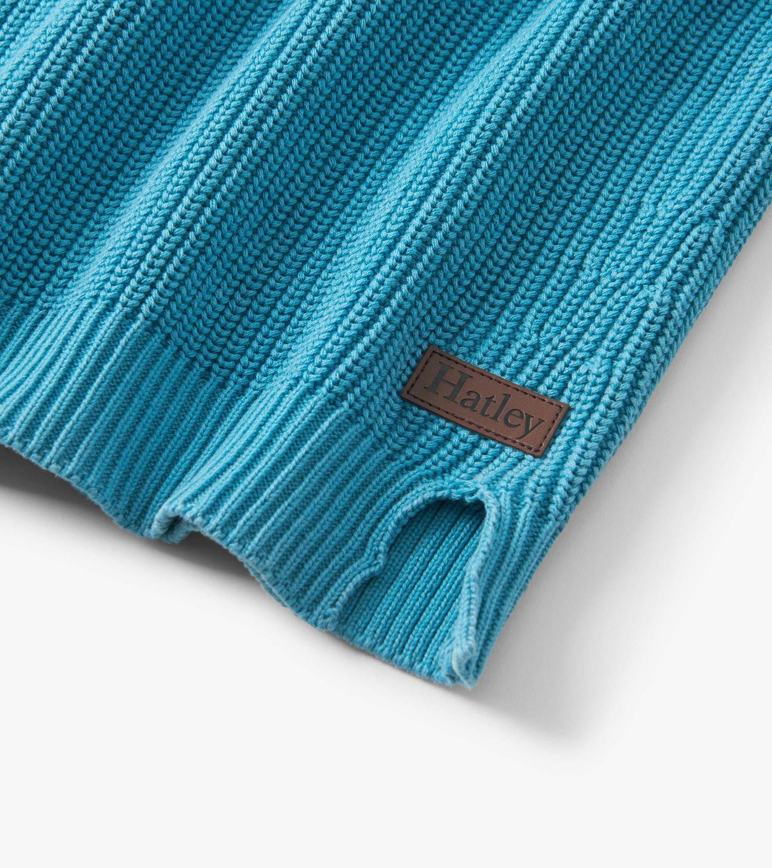 Teal button neck sweater with ribbed texture and a small logo patch, suitable for boys.