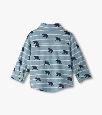 Light blue button-down shirt with navy bear print and horizontal stripes, featuring long sleeves and a collar.