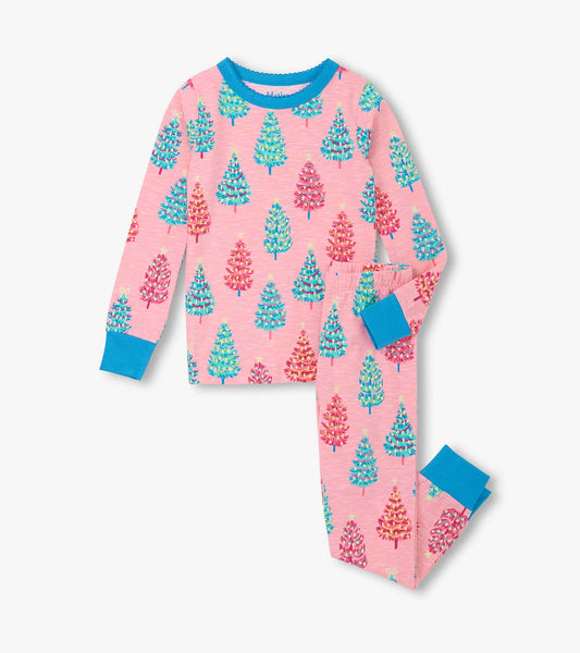 Pink cotton pajama set featuring colorful bottle brush trees, with blue cuffs on the long-sleeve top and pants.