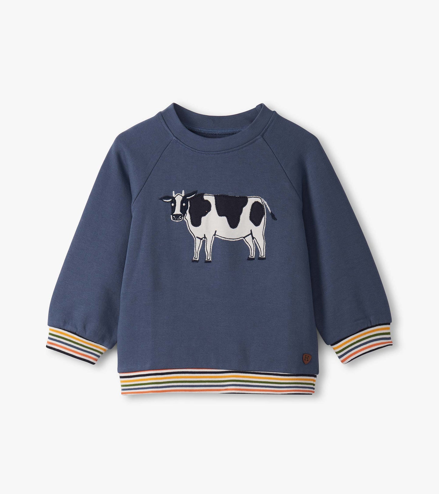 Navy pullover sweatshirt for toddlers featuring a cow graphic and colorful striped cuffs and hem.
