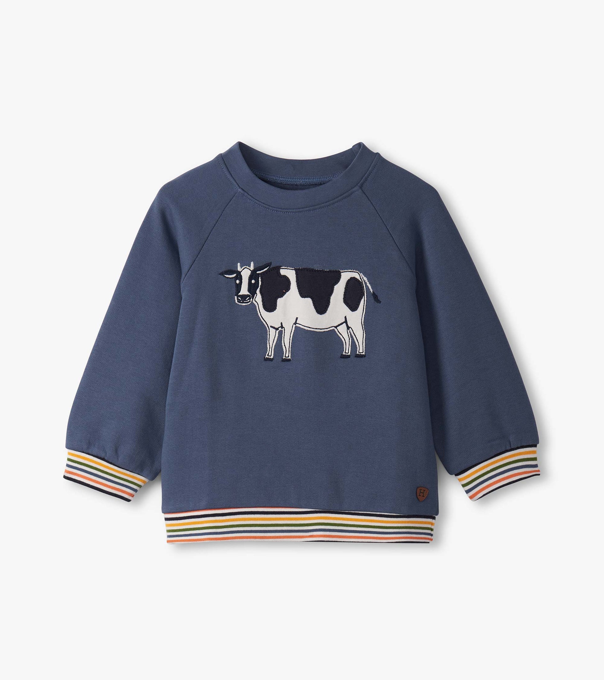 Navy pullover sweatshirt for toddlers featuring a cow graphic and colorful striped cuffs and hem.