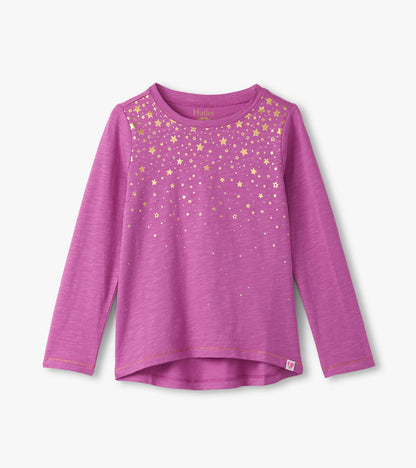 Long sleeve pink graphic tee featuring a gold star pattern across the chest. Soft, lightweight fabric.