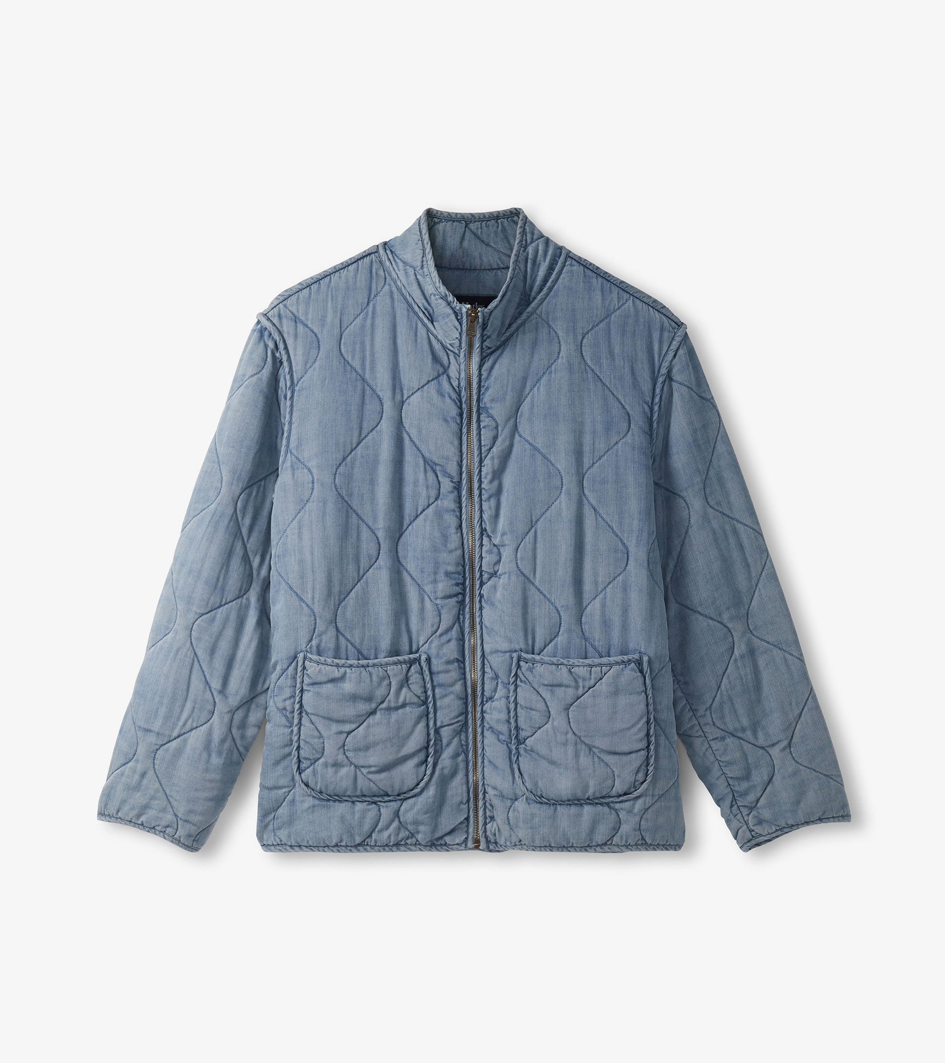 Quilted jacket in washed blue Tencel with a zip front, stand collar, and two front pockets.