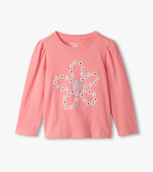 Pink long-sleeve tee featuring embroidered flower design with puff sleeves. Suitable for girls.