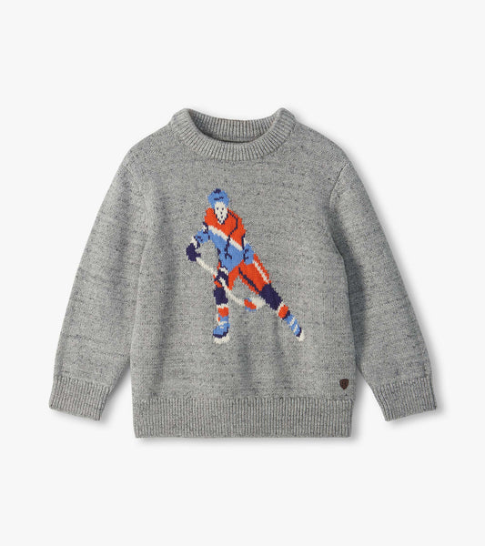 Gray crew neck sweater with a large hockey player graphic in blue, orange, white, and navy on the front