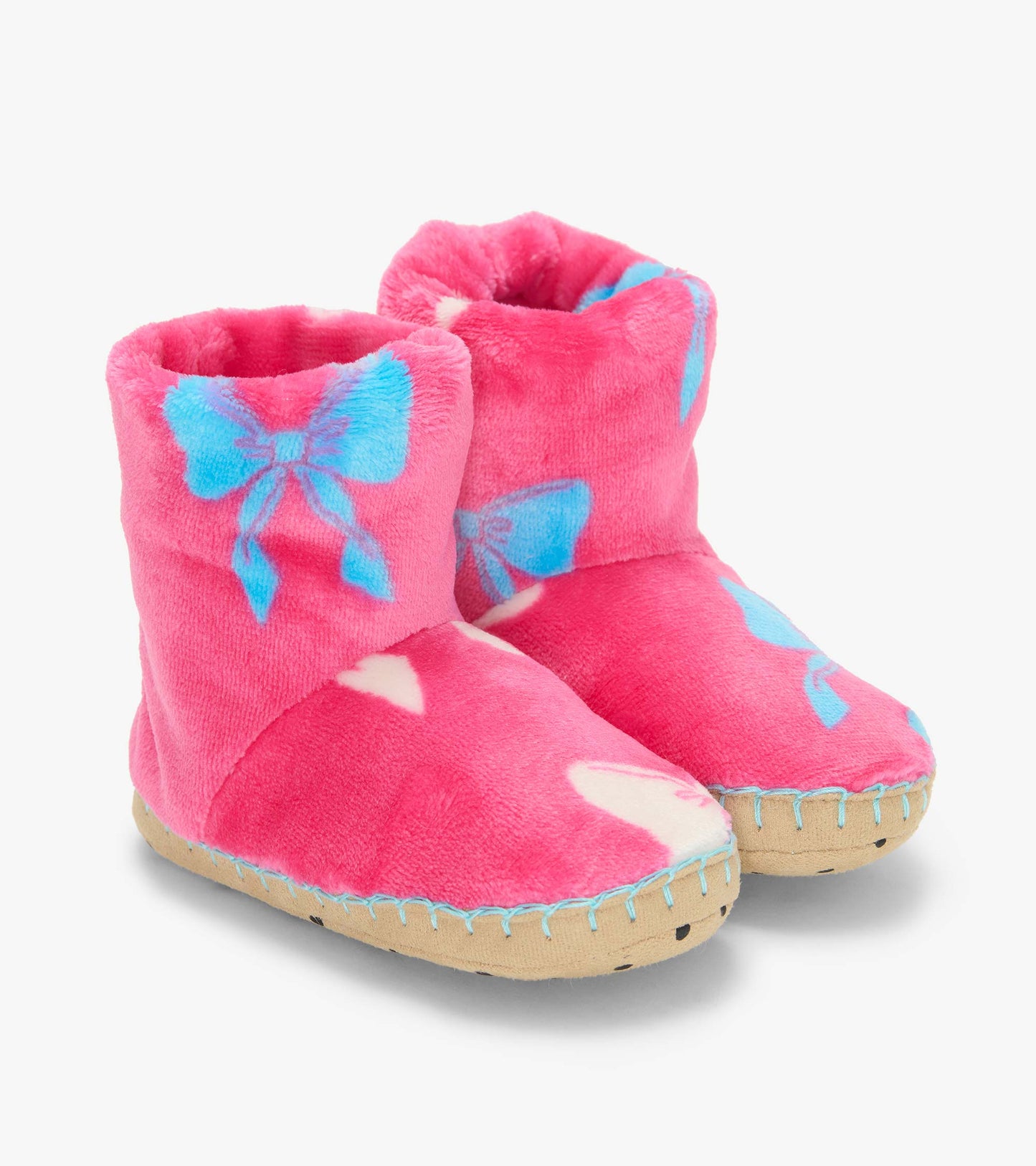 Pair of pink slipper boots with blue bow print, white hearts, and tan soles