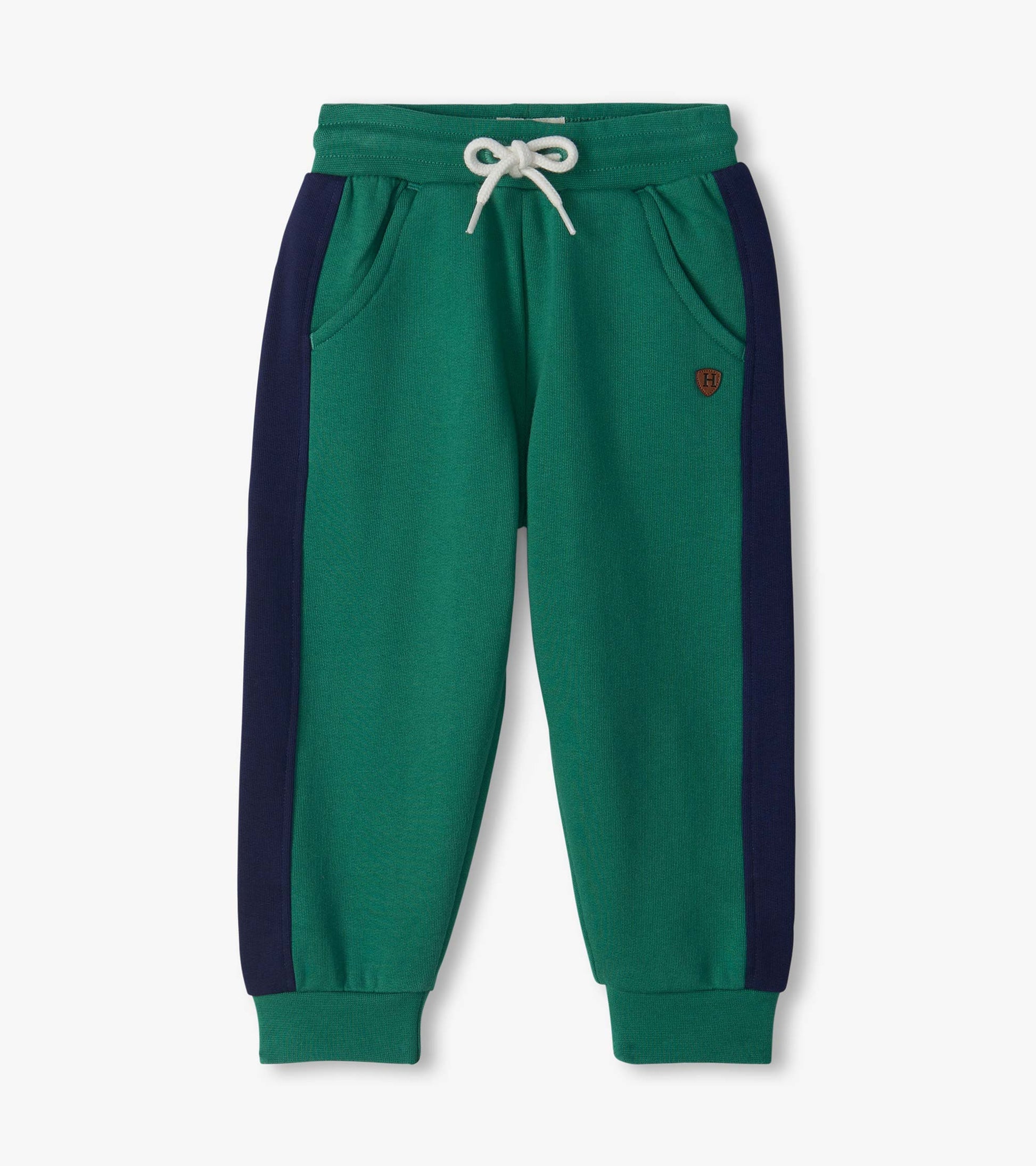 Bottle green track pants with navy side panels, white drawstring waist, side pockets, and cuffed ankles