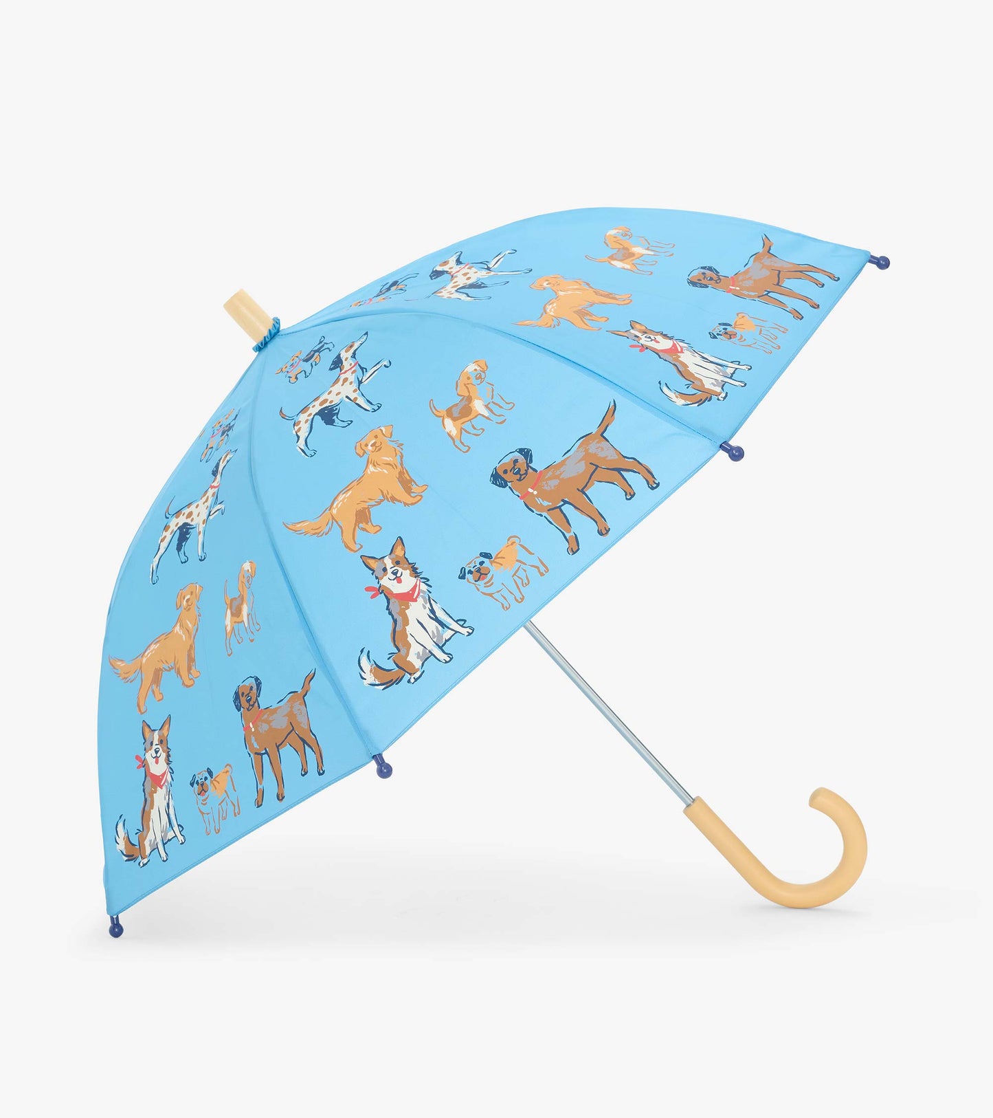 Open blue kids umbrella with dog print and curved light wood handle, shown at an angle
