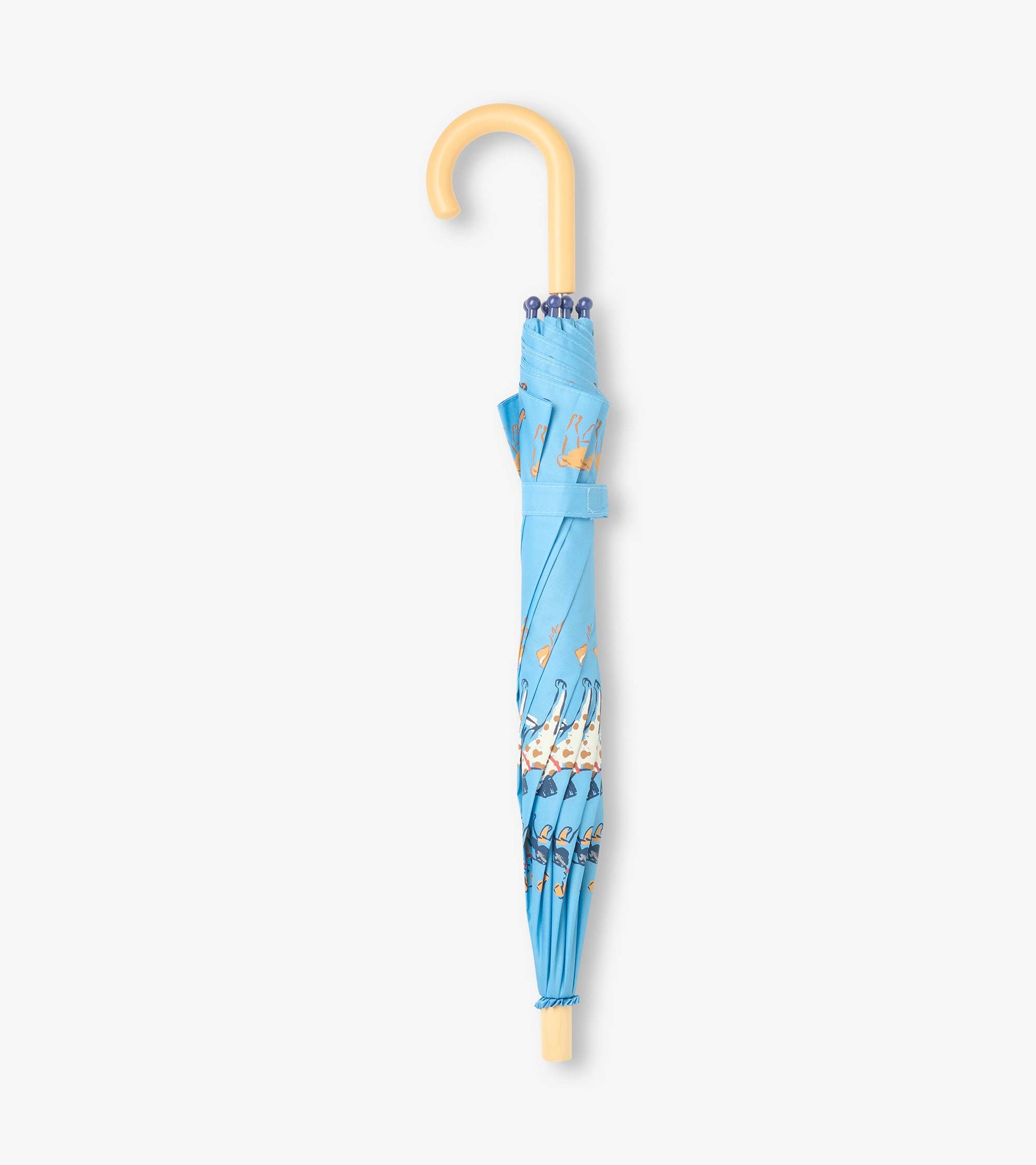 Closed blue kids umbrella with dog print, strap wrap, and curved light wood handle