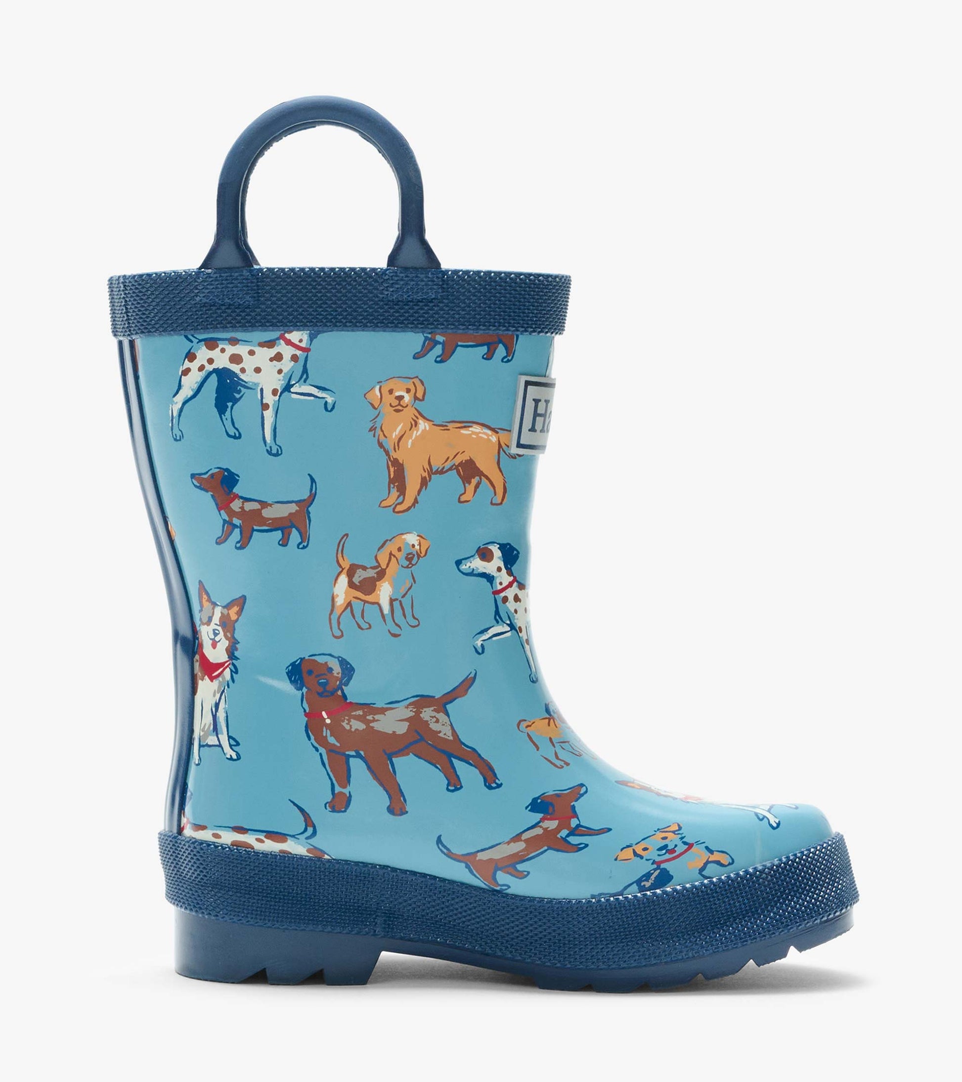 Single blue kids rain boot with navy handle and dog print, side view