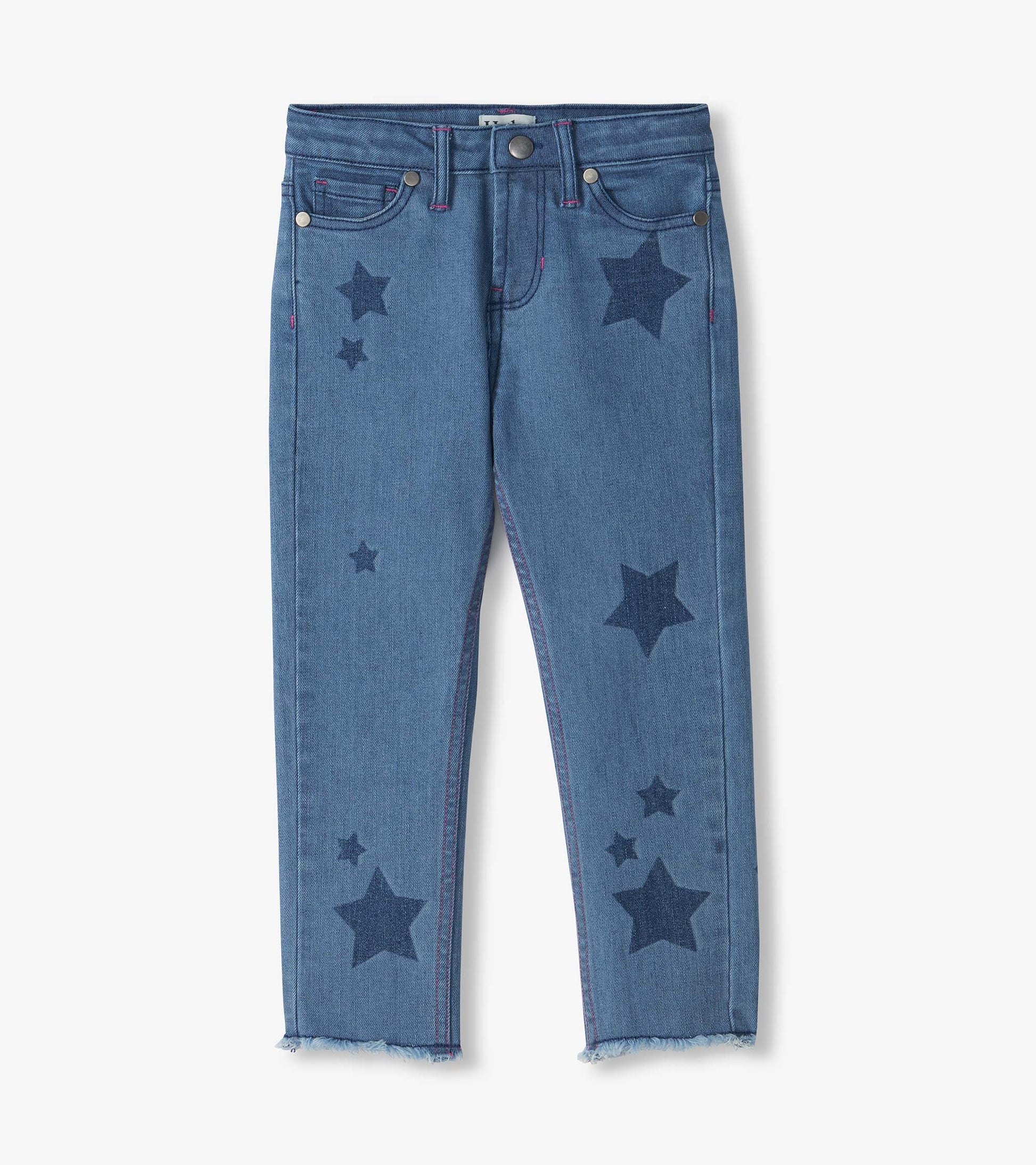 Front view of blue slouchy jeans with dark star print, pink stitching, and frayed hems
