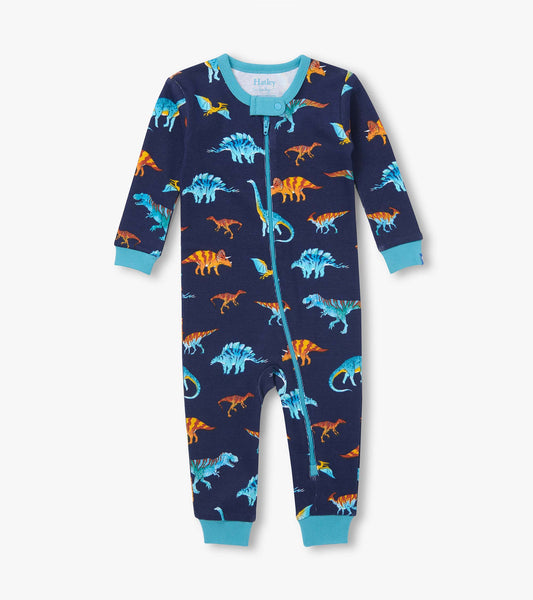 Front view of infant coverall in navy with colorful dinosaur print, teal trim, and asymmetrical zip closure
