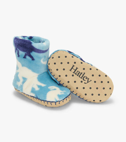 Blue Dino Silhouette fleece slippers with one sole shown, featuring black dots and visible Hatley logo