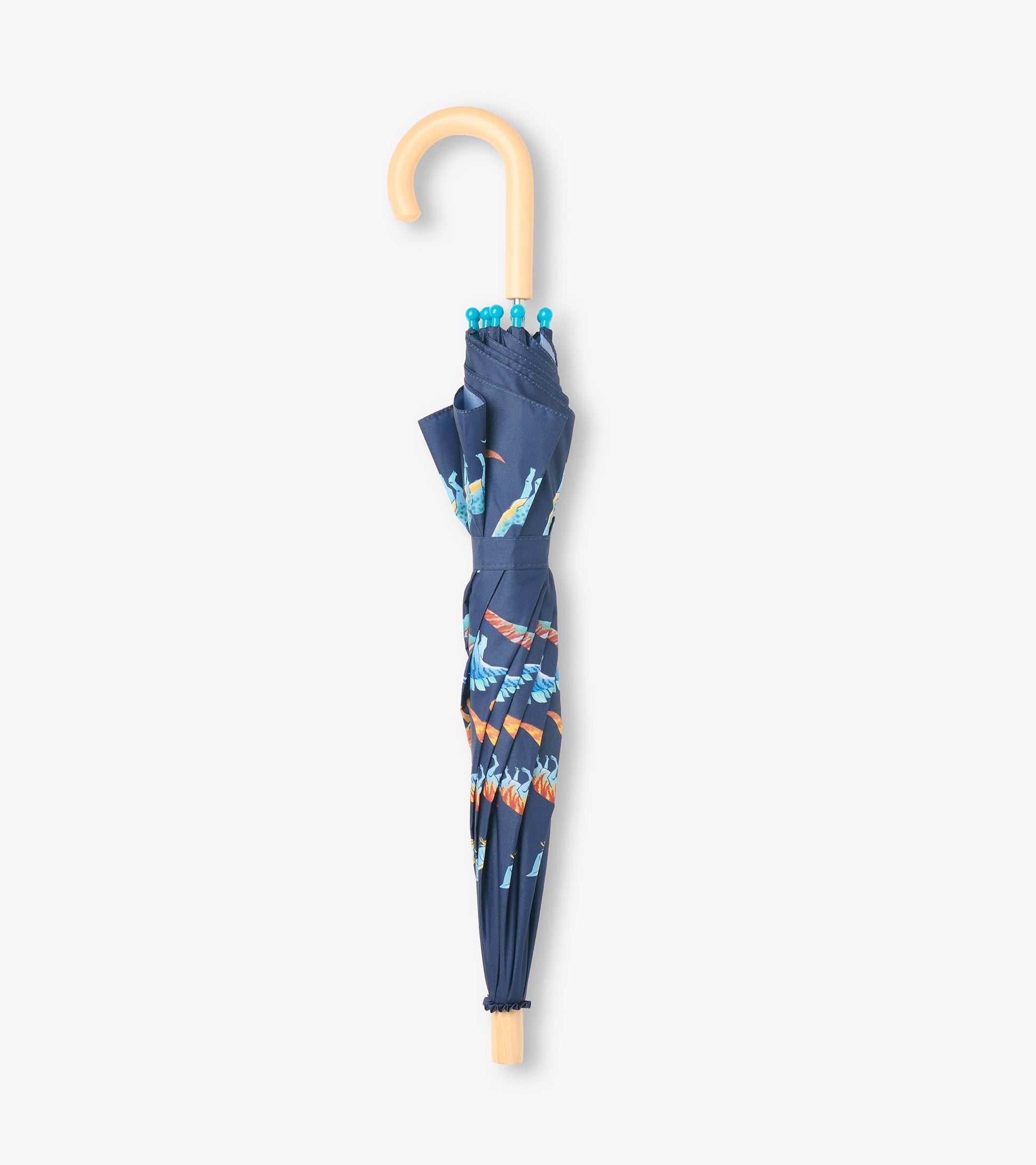 Closed navy umbrella with colorful dinosaur print and curved light wood handle