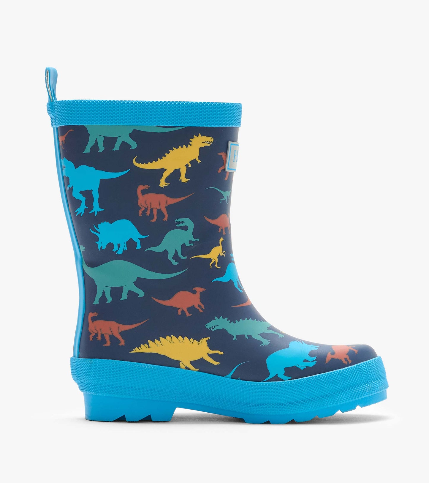 Side view of navy kids rain boot with colorful dinosaur print and bright blue sole and trim