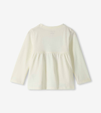 Back view of cream long-sleeve toddler T-shirt with gathered waist seam