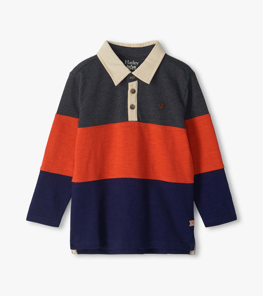 Kids long sleeve polo top with navy, orange and dark gray colorblock panels and a beige collar