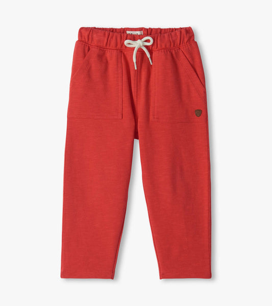 Infant chrysanthemum pull-on pants with elastic waist, white drawstring, front pockets, and tapered legs