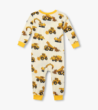 Back view of infant coverall with yellow cuffs and allover construction truck print