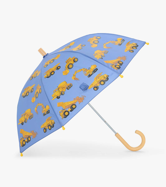 Open blue kids umbrella with yellow construction truck print and curved pale handle