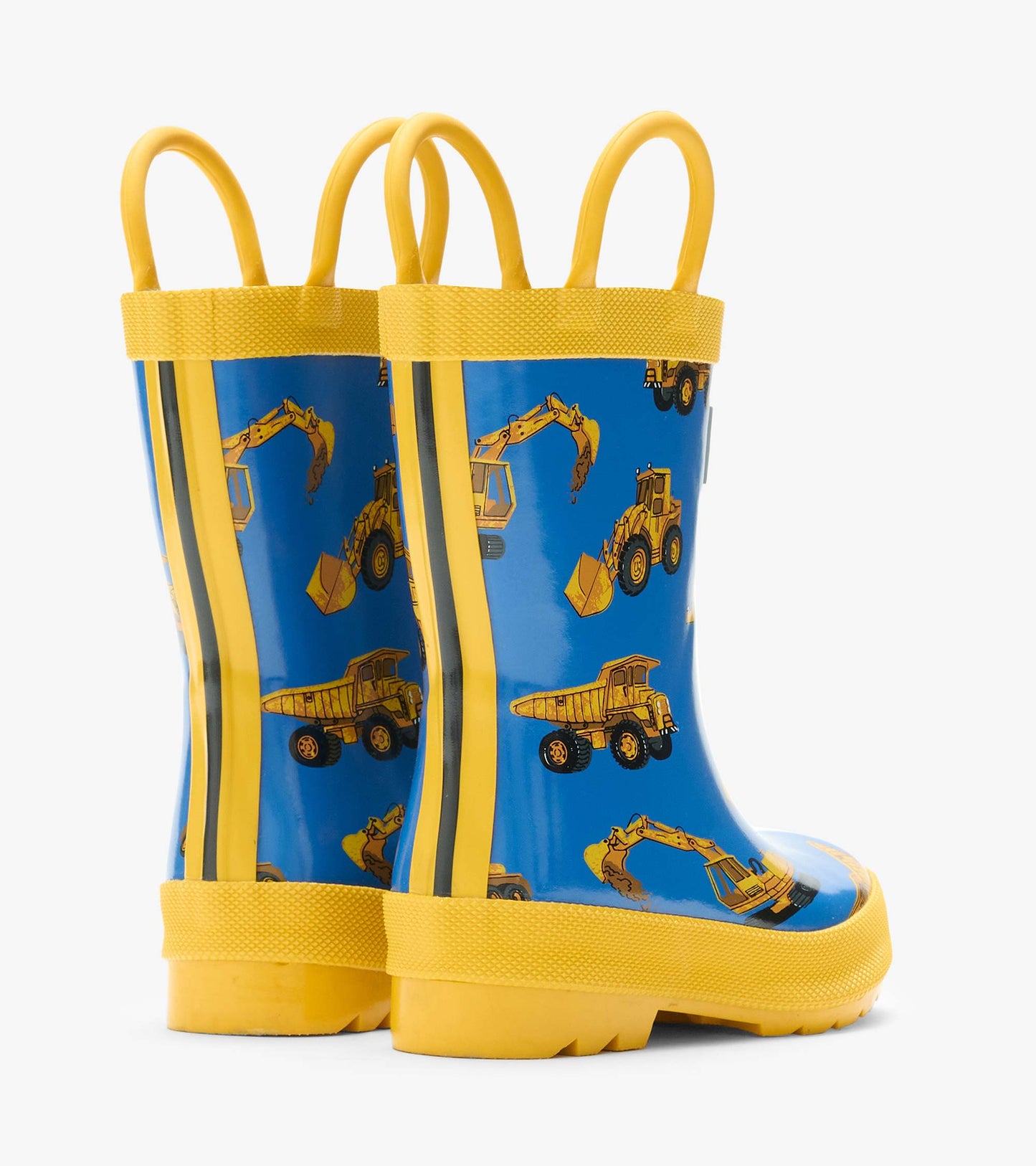 Back view of blue kids rain boots with yellow handles and construction truck print